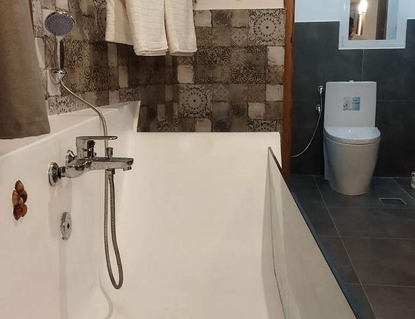 Luxury bathroom with glass bathtub and toilet